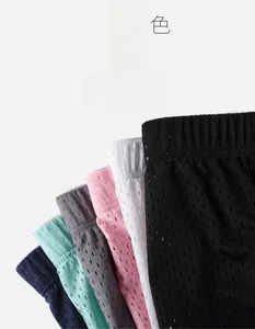 Detail of breathable ice silk mesh men's shorts in six vibrant colors and elastic waistband