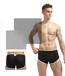 Detailed view of black breathable mesh boxer shorts with contrasting white piping trim