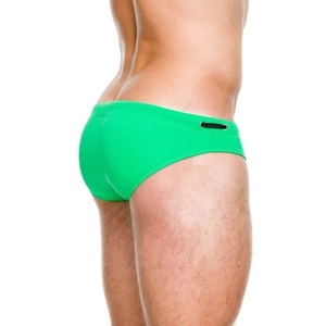 Detail of bright green men's swim briefs featuring a low-waist cut and side drawstring hole