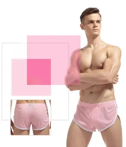 Pink men's mesh sports shorts featuring breathable holes and white contrast piping details