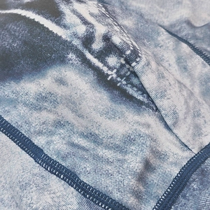 Macro shot of quick-dry denim print fabric with seamless stitching for men's swim trunks