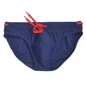 Flat lay view of men's navy blue swim briefs with elastic waist and red drawstrings