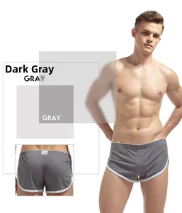 Detail view of dark grey mesh boxer shorts with white piping and breathable fabric