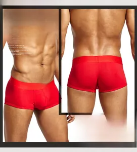 Close-up of red cotton men's boxer briefs showing the waistband and U-convex design pouch