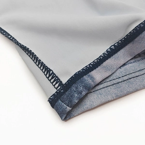 Detailed close-up of quick-dry men's swimwear with durable four-needle six-thread stitching