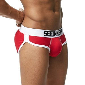 Dettaglio slip da uomo in cotone rosso con ampia fascia elastica bianca e logo