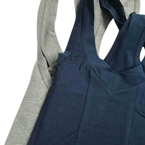 Close-up of ribbed cotton texture and V-neckline on men's shaping bodysuit singlet