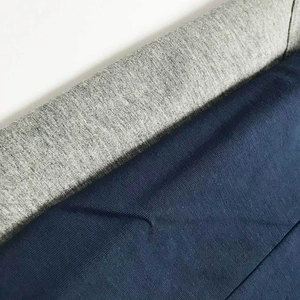 Macro detail of high-quality gray and navy cotton knit fabric stitching for men's bodysuits