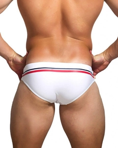 Rear view of white men's swim briefs with red, blue and black striped elastic waistband