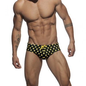 Men's athletic swim briefs with yellow star print and drawstring in black and yellow