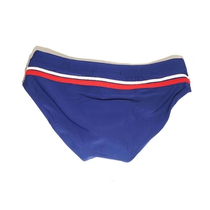 Close-up of men's navy swim briefs featuring elastic red and white striped waistband