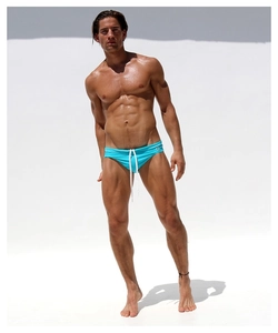 Men's cyan low-waisted swim briefs featuring white adjustable drawstring and smooth fabric