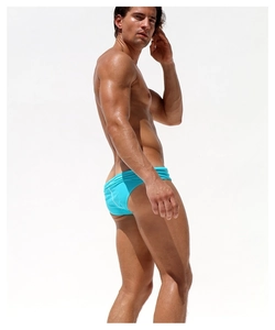 Detailed back view of men's turquoise low-rise swim briefs with elastic quick-dry fabric