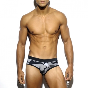 Front view of men's camouflage swim briefs with elastic waistband on athletic model