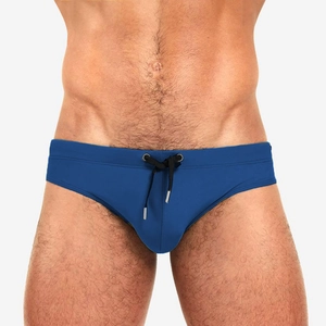 Men's solid navy blue competitive swim briefs with athletic drawstring and metal aglets