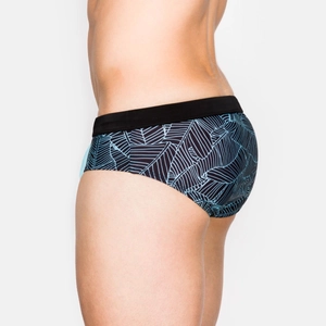 Men's abstract leaf print swim briefs with black elastic waistband and athletic fit
