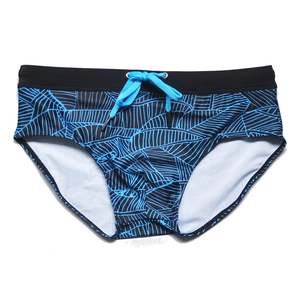 Men's swim briefs with blue leaf pattern and black waistband featuring adjustable drawstrings