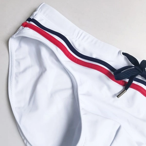 Men's white nylon swimming briefs with red and blue stripes and adjustable drawstring