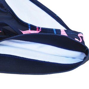 Detailed macro view of men's flamingo swim trunks showing elastic waist and double lining