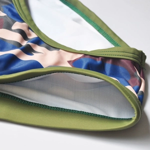 Close-up of camouflage swim briefs showing high-elastic fabric and fine stitching detail