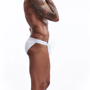 Close-up of white high-cut cotton briefs for men showing breathable fabric and supportive pouch