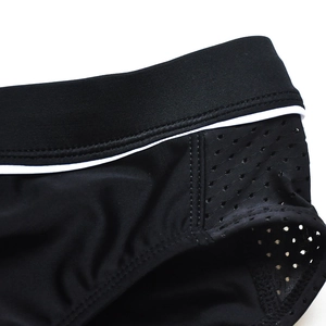 Detail of mens black swim briefs with mesh patchwork and contrast elastic waistband