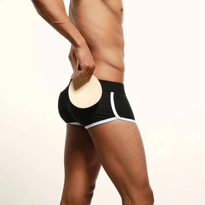 Detail of men's padded boxer briefs in black with white trim and round butt pads