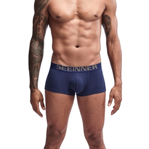 Detail of navy blue cotton boxer briefs with elastic SEEINNER waistband on male model