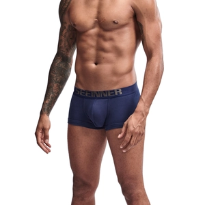 Detail of navy cotton boxer briefs featuring wide elastic waistband and ergonomic U-pouch