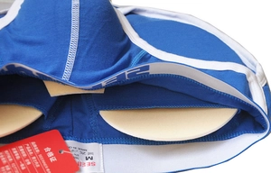 Close-up of blue men's briefs with removable 3D padding for shape enhancement