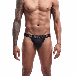 Close-up of black cotton men's jockstrap with wide elastic waistband and logo detail
