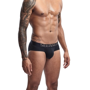 Close-up of black men's cotton briefs showing wide elastic waistband and U-convex design