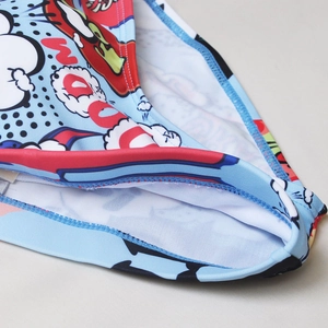 Detail of blue pop art swim briefs showing high-quality zigzag stitching and soft lining