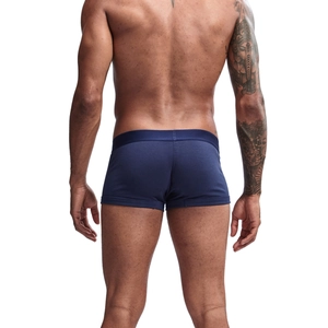 Rear view of navy blue cotton boxer briefs with wide elastic waistband on male model