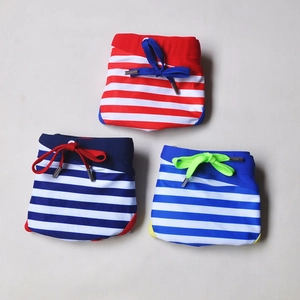Three pairs of striped men's swim briefs in red, navy, and royal blue with drawstring details