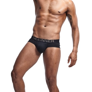 Detailed close-up of premium black cotton briefs showing ergonomic U-convex pouch fit