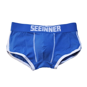 Detailed blue cotton boxers showing white contrast stitching and wide logo waistband