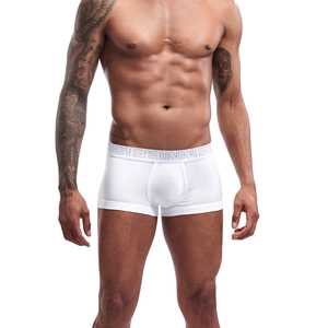 Close-up of white cotton boxer briefs with a wide elastic waistband and U-pouch