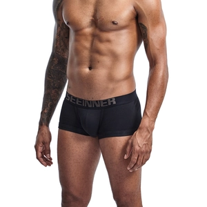 Detail view of men's black boxer briefs with wide branded waistband and U-convex design