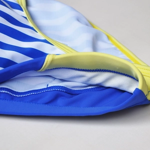 Detail of navy stripes swim briefs with yellow piping and high-elastic stitching