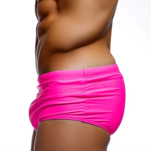 Detailed side view of fuchsia tight swimming trunks showing elastic nylon fabric seams