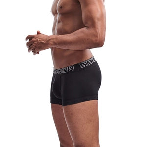 Close-up of men's black cotton boxer briefs showing wide elastic waistband and snug side fit