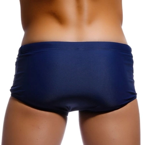 Rear view of deep blue loose fitting men's swim shorts with elastic quick dry fabric
