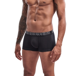 Macro detail of the elastic waistband and breathable cotton fabric on black boxer briefs