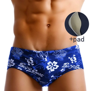 Men's navy skull and floral swim trunks with removable sponge padding detail