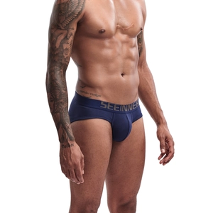 Detail of navy blue cotton briefs with a wide elastic waistband and contoured U-pouch fit