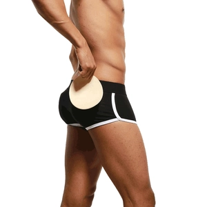 Men's cotton padded boxer shorts in black with white trim for buttock enhancing effect