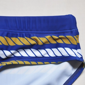 Detail of nautical rope print on navy blue mens swim briefs with high elastic fabric