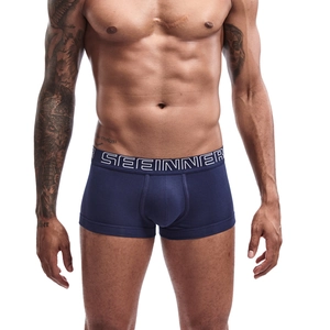 Detail of navy blue cotton boxer briefs featuring a wide elastic branded waistband
