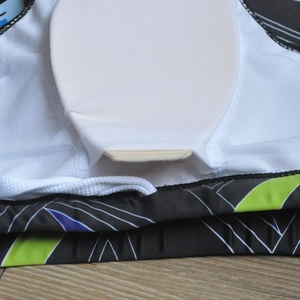 Detail of men's swim trunks showing white mesh lining and removable protective foam pad
